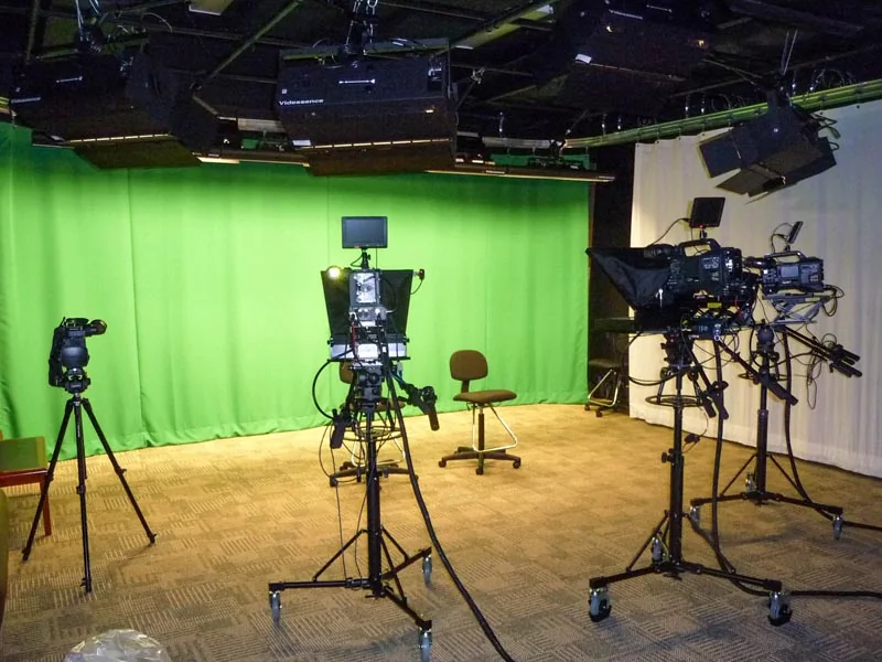 The Aitterce studio floor, cameras set against a green screen